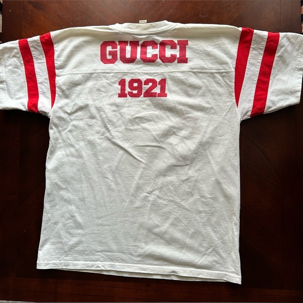 Gucci White Tee with Red Number Design UNISEX
100 music is mine - Picture 8 of 10